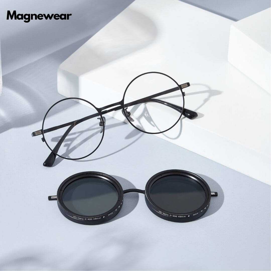 Two pairs of Magnewear shade adjustable sunglasses with gold and black frames and magnetic lenses