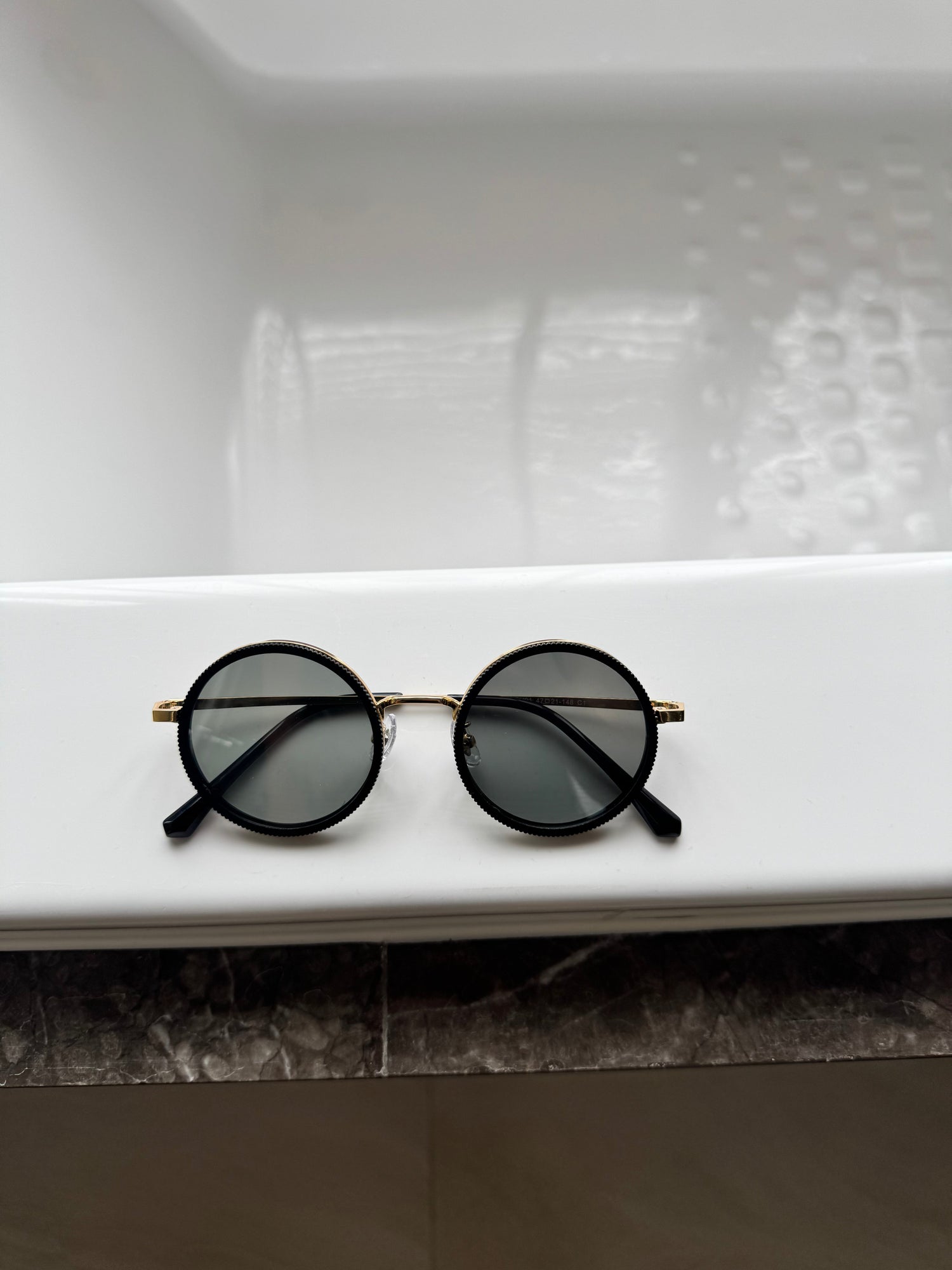 Magnetic clip on glasses with interchangeable tinted lenses and black frame on display